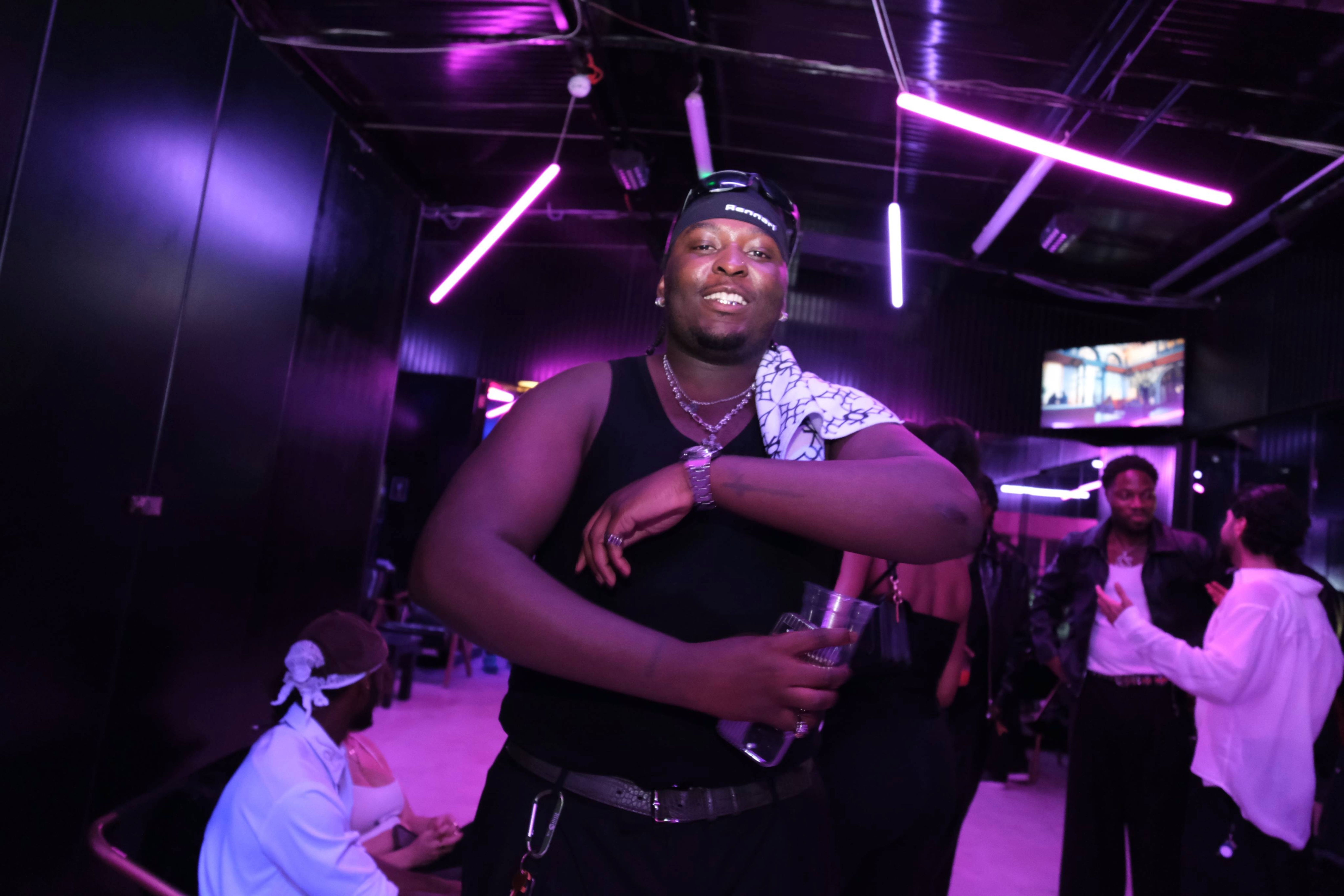 Member under violet club lights