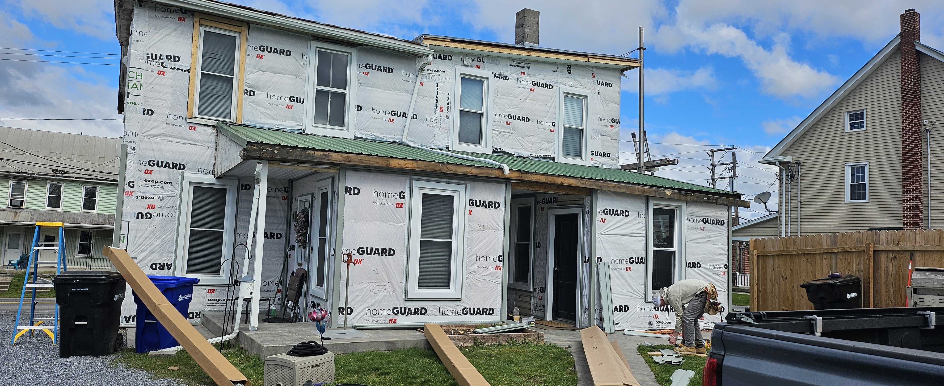 Siding before — damaged siding on residential home