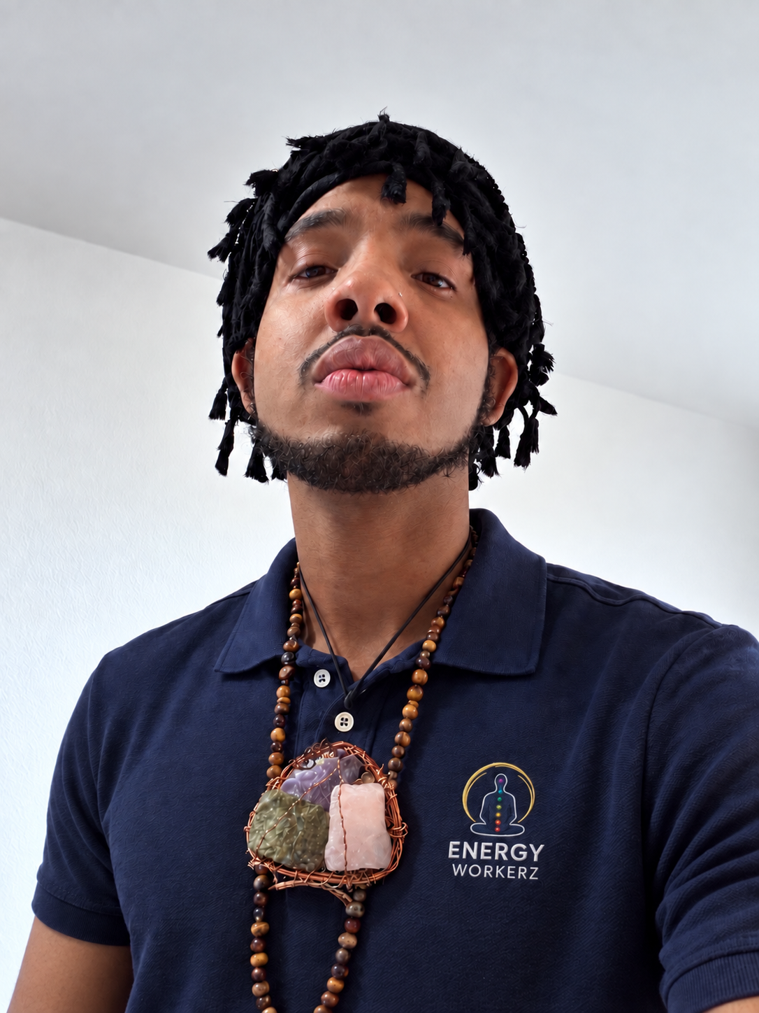Melek Hol Kor wearing an Energy Workerz polo